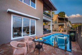 StayVista's Skyline Villa - Mountain-View Villa with Swimming Pool and Terrace
